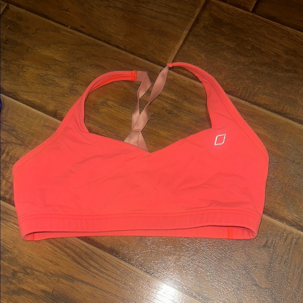 Lorna Jane coral colored sports bra